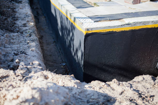 Professional Waterproofing technician working in Edon, OH